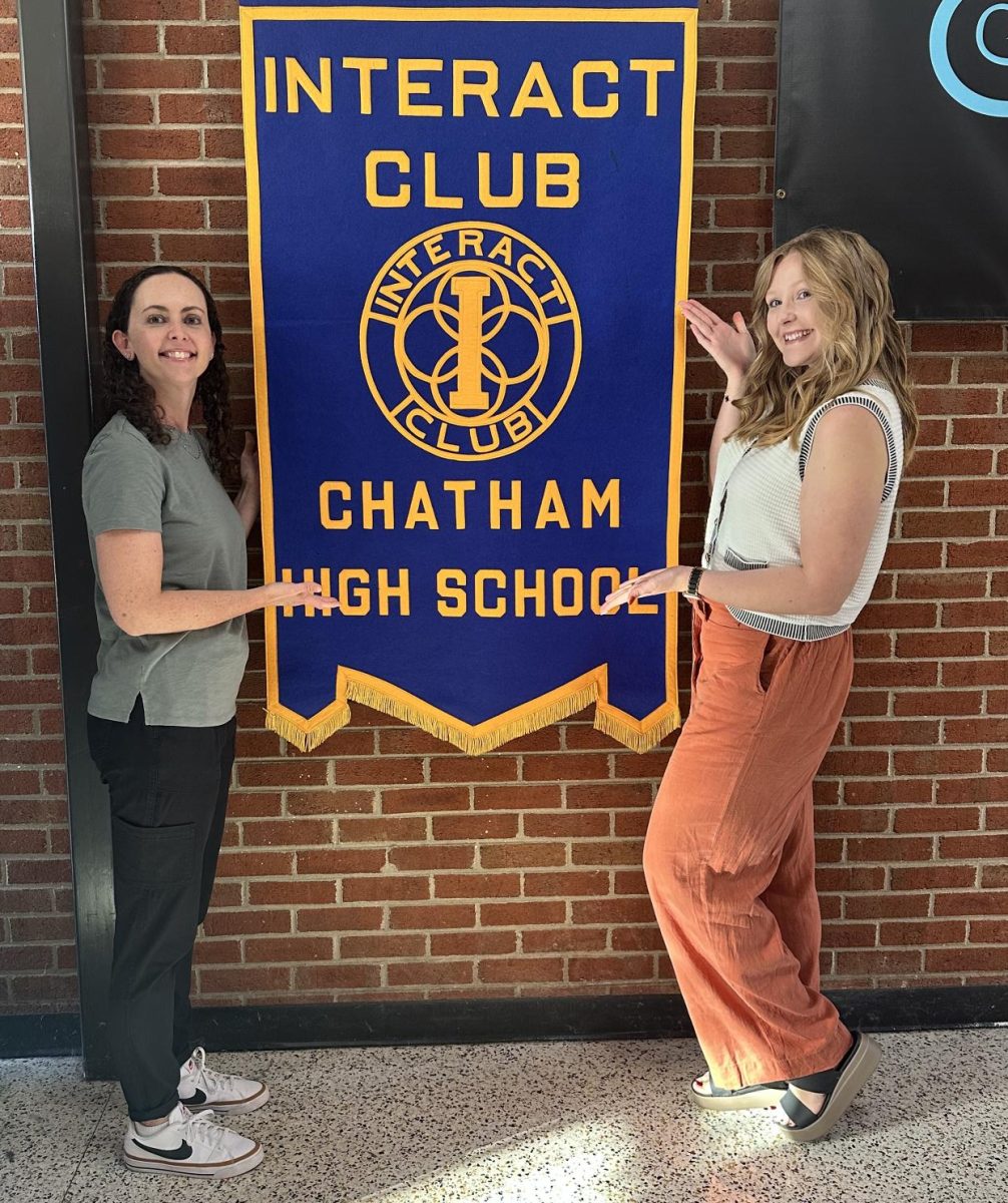 Left to right: Mrs. Rebecca Parsons and Mrs. Allison Puckett emphasize the banner. 